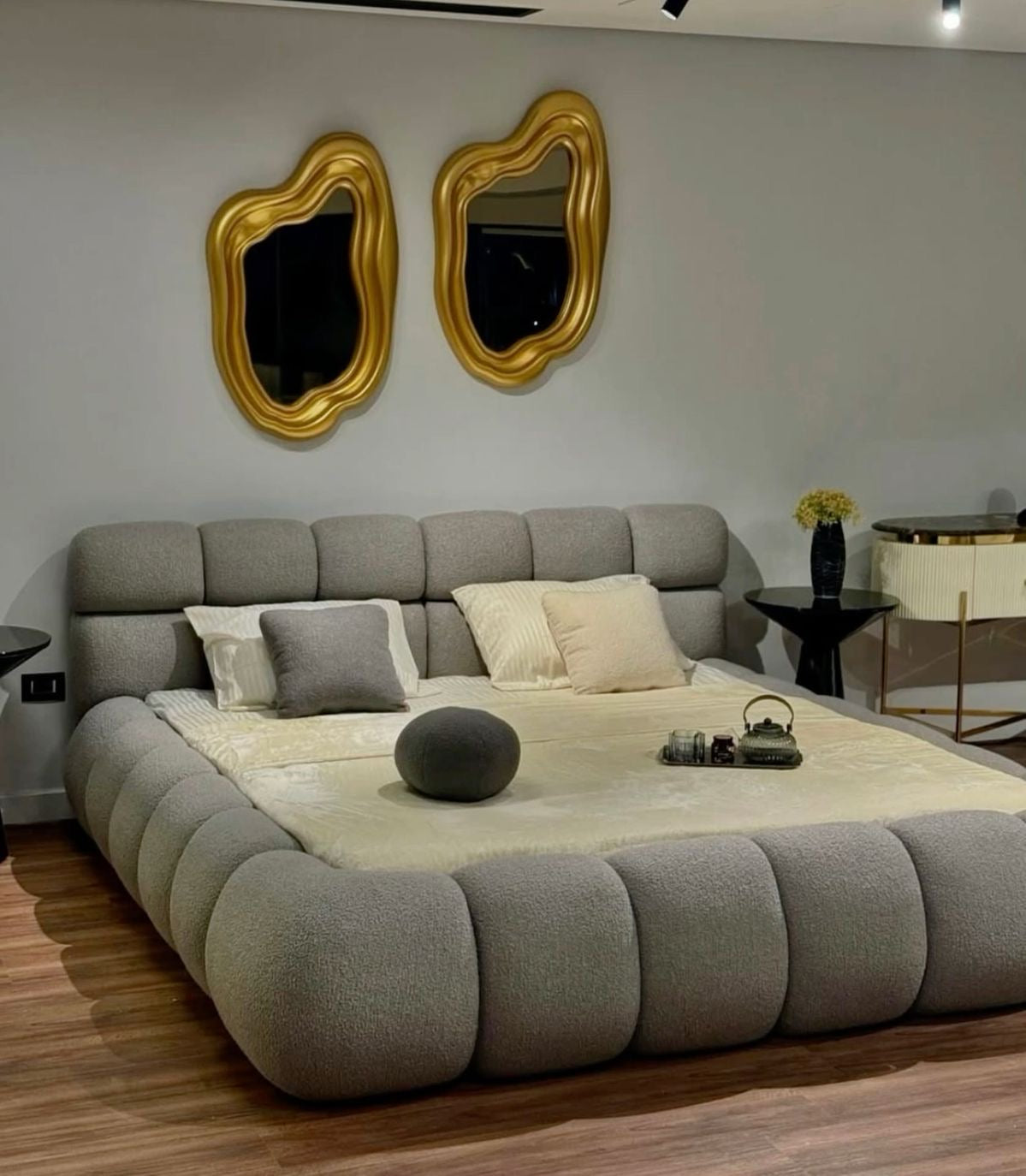 oversized-bubble-tufted-boucle-bedframe-grey
luxury-cloud-pebble-bed-with-textured-upholstery
modern-low-profile-plush-tufted-master-bed