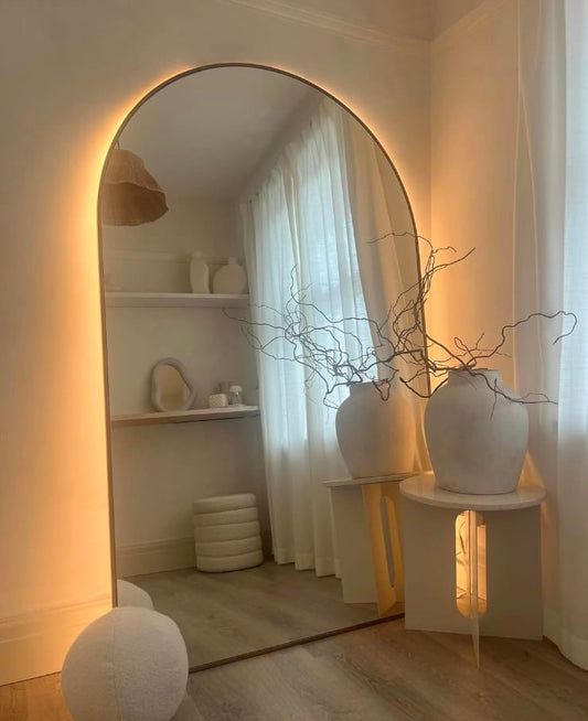 Big Arc oversized arched wall mirror 76 by 44 inches with metal frame, DUCO finish, and back LED lighting.