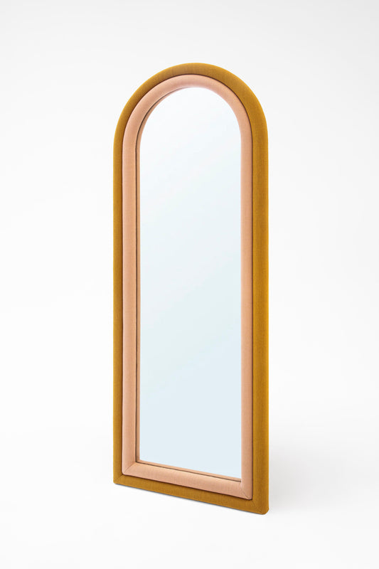 Ringo upholstered arched wall mirror in pink and mustard fabric 65 by 24 inches for modern interiors.