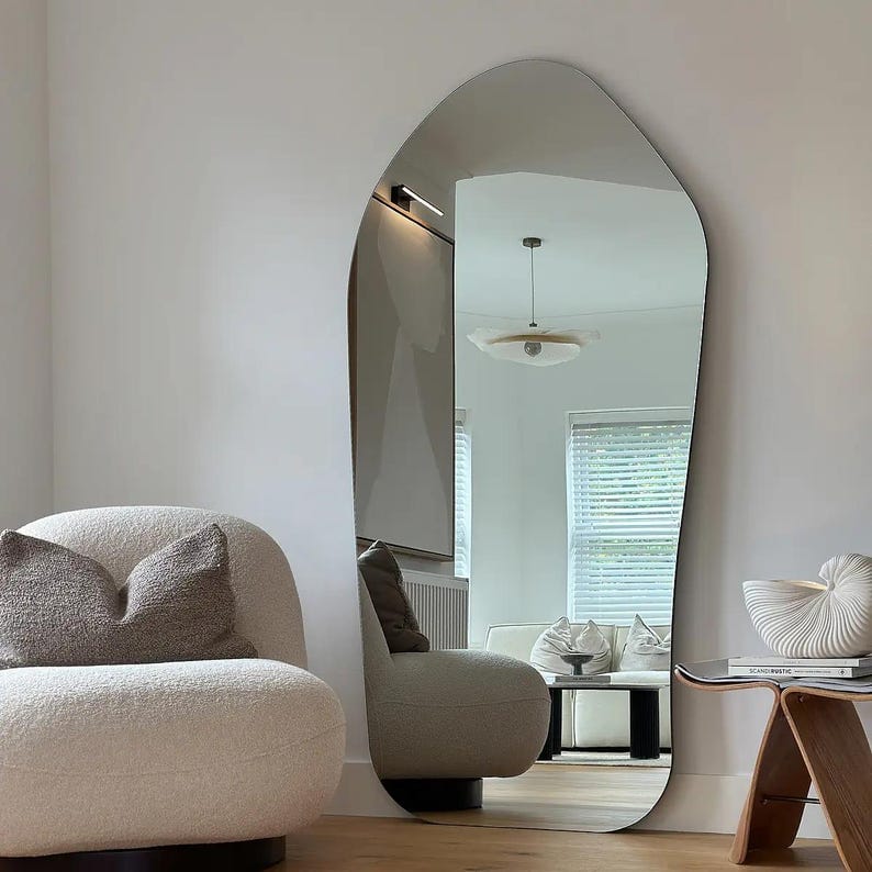 Virgil asymmetrical full-length floor mirror 70 by 30 inches with modern wave-inspired design.